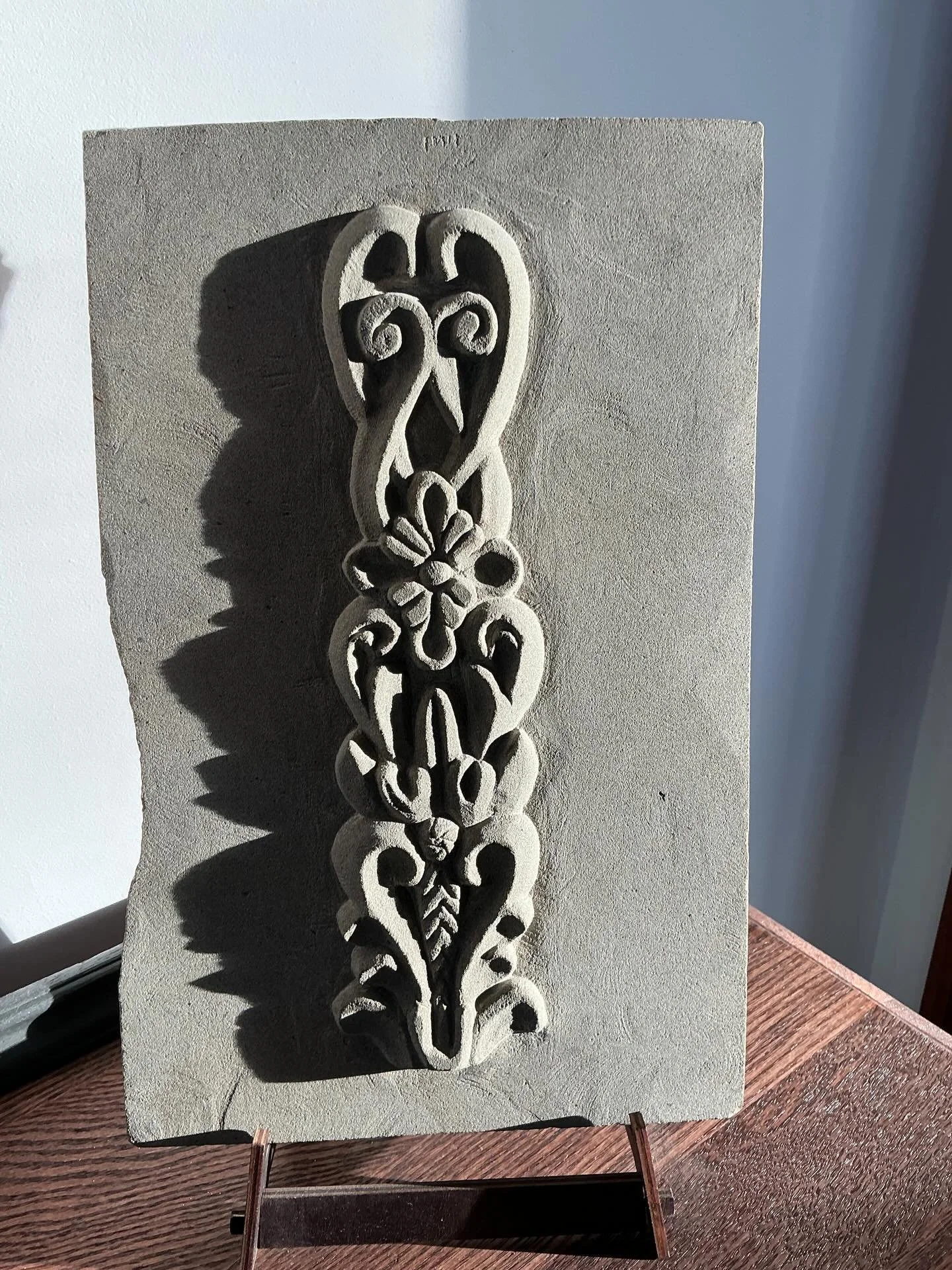 An older carving in a new light as Spring sunshine streams into our foyer. Reproduction of a Spanish door carving from San Miguel d&rsquo;Allende, Mexico #stonecarving #basreliefsculpture #sanmigueldeallende❤️ #sandstone #handcarving