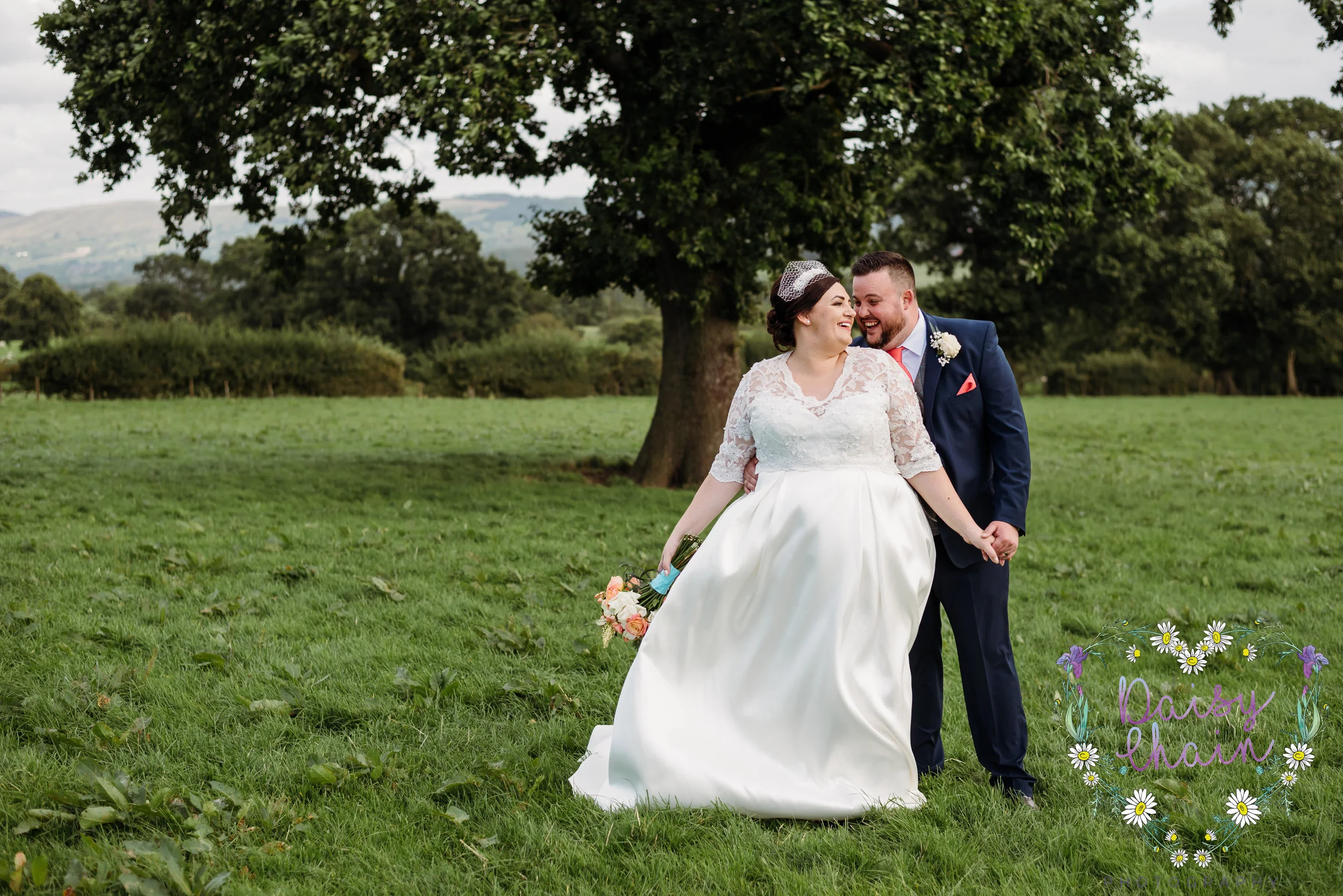 Bride and groom in a field