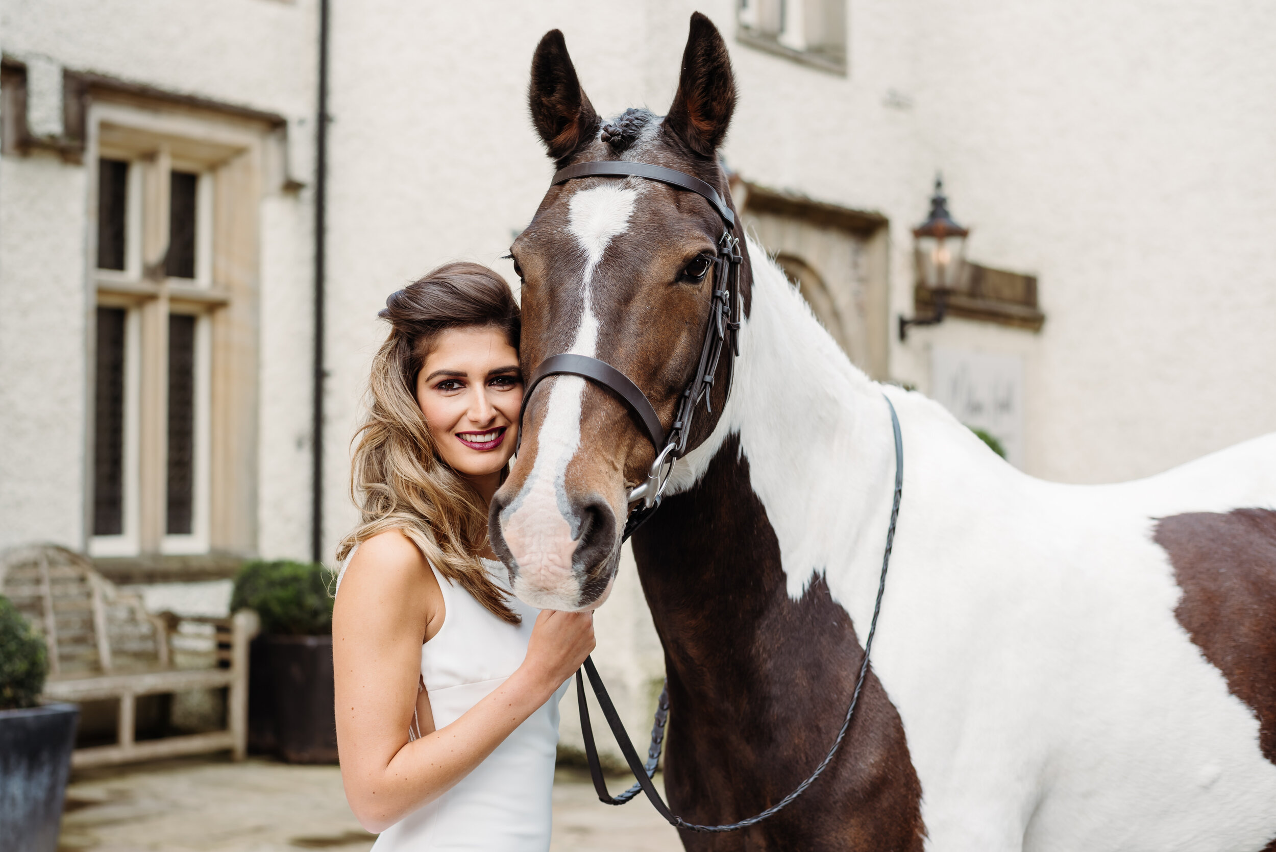 Gorgeous bride and a coloured horse