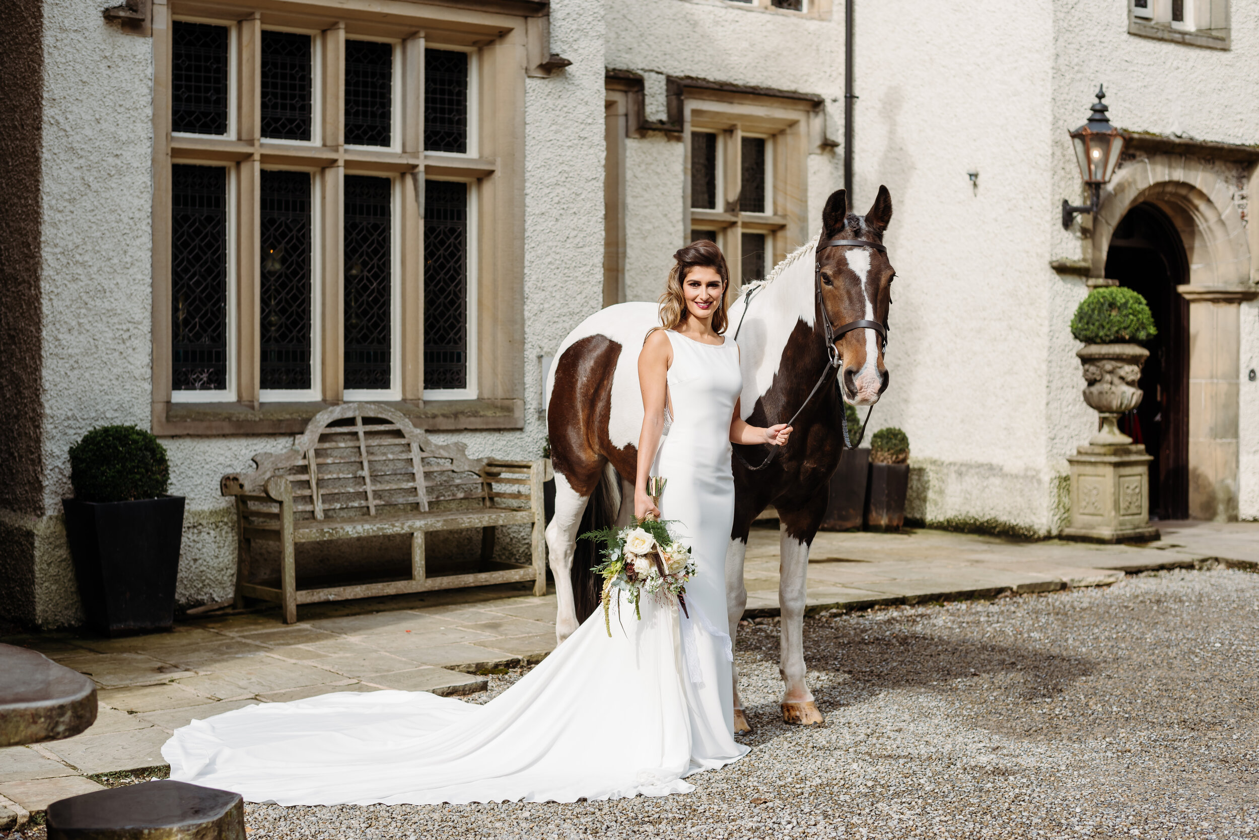 Bride with a gorgeous horse outside Mitton Hall