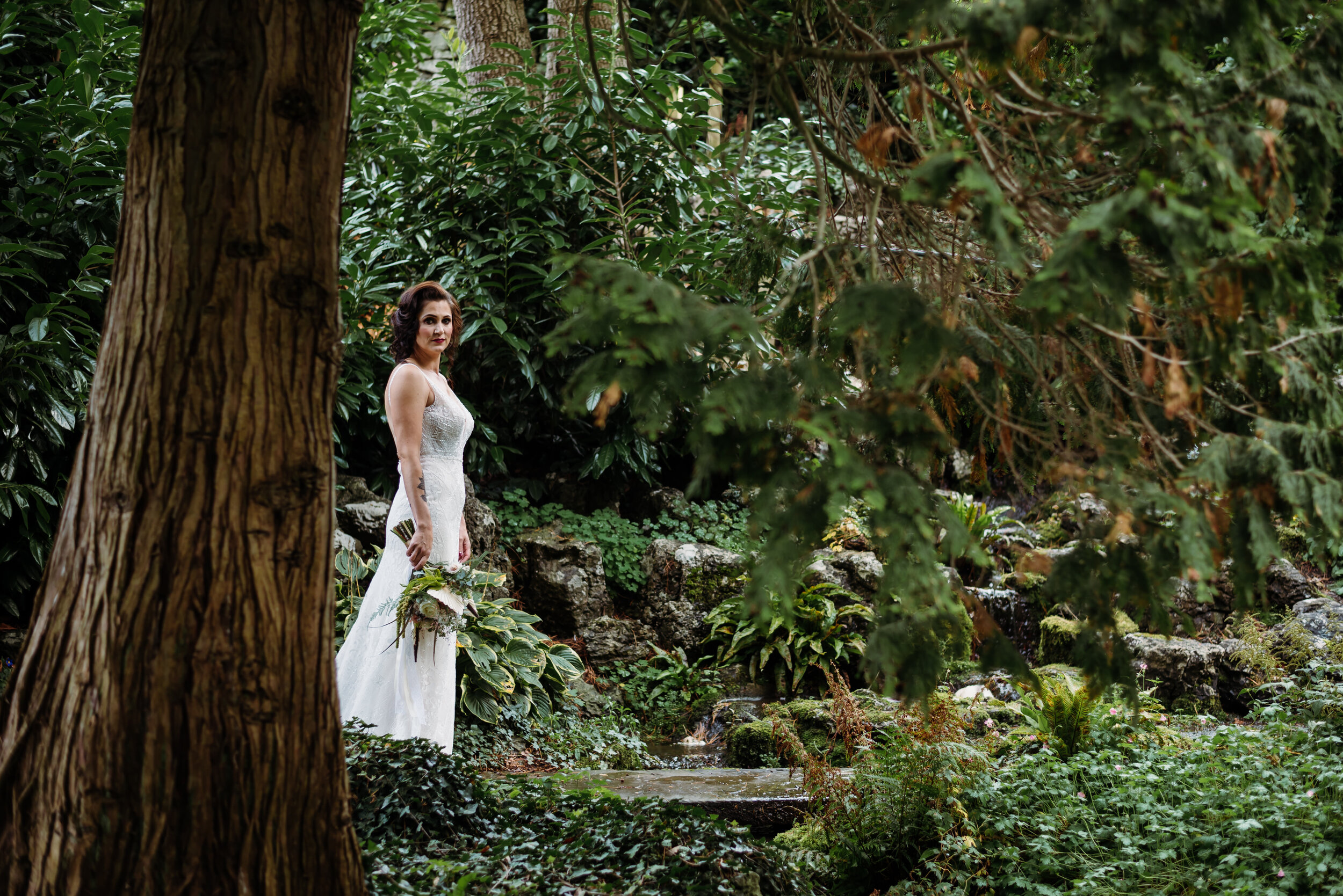 Beautiful bride in the secret garden at Mitton Hall