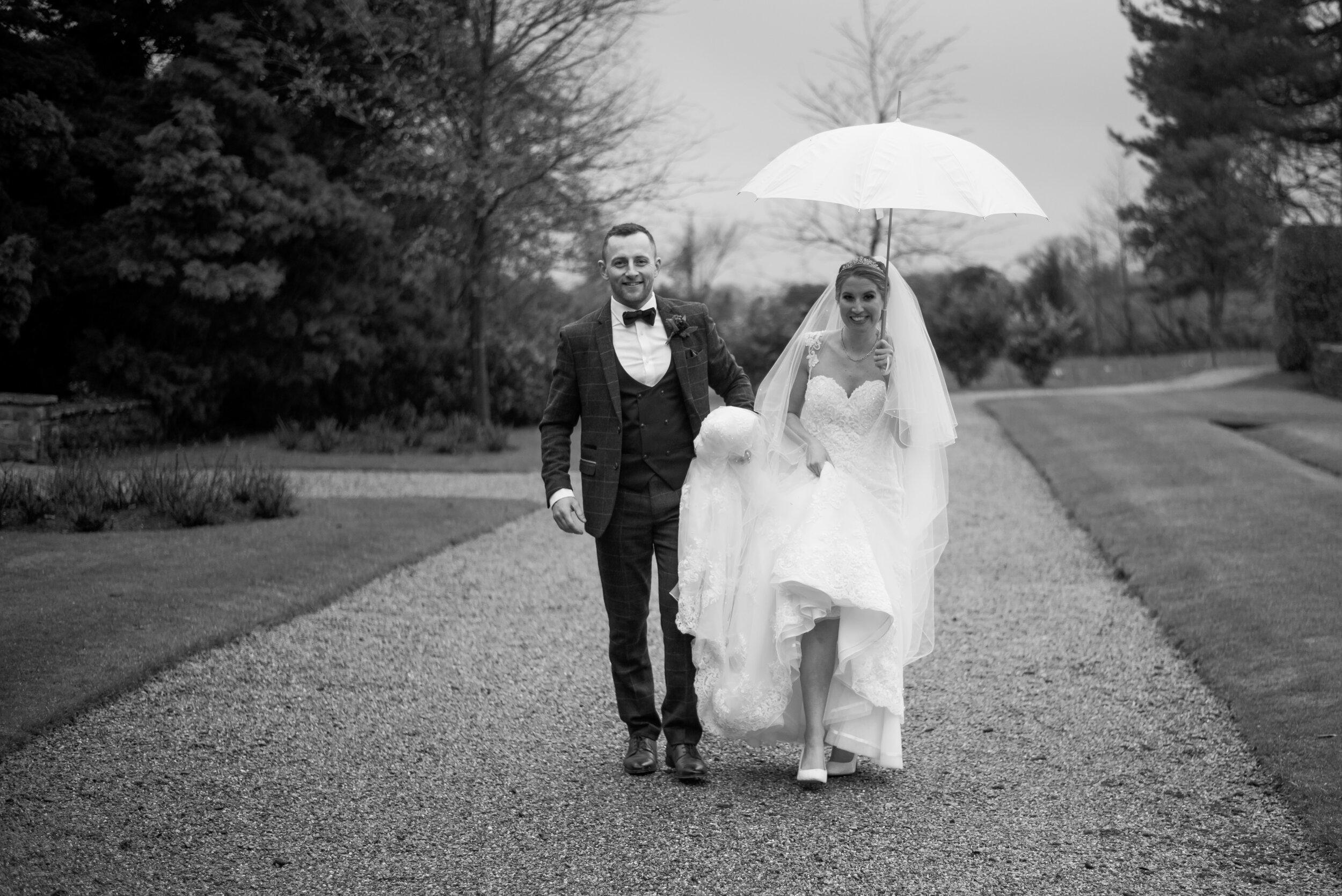 The rain won't stop this bride and groom