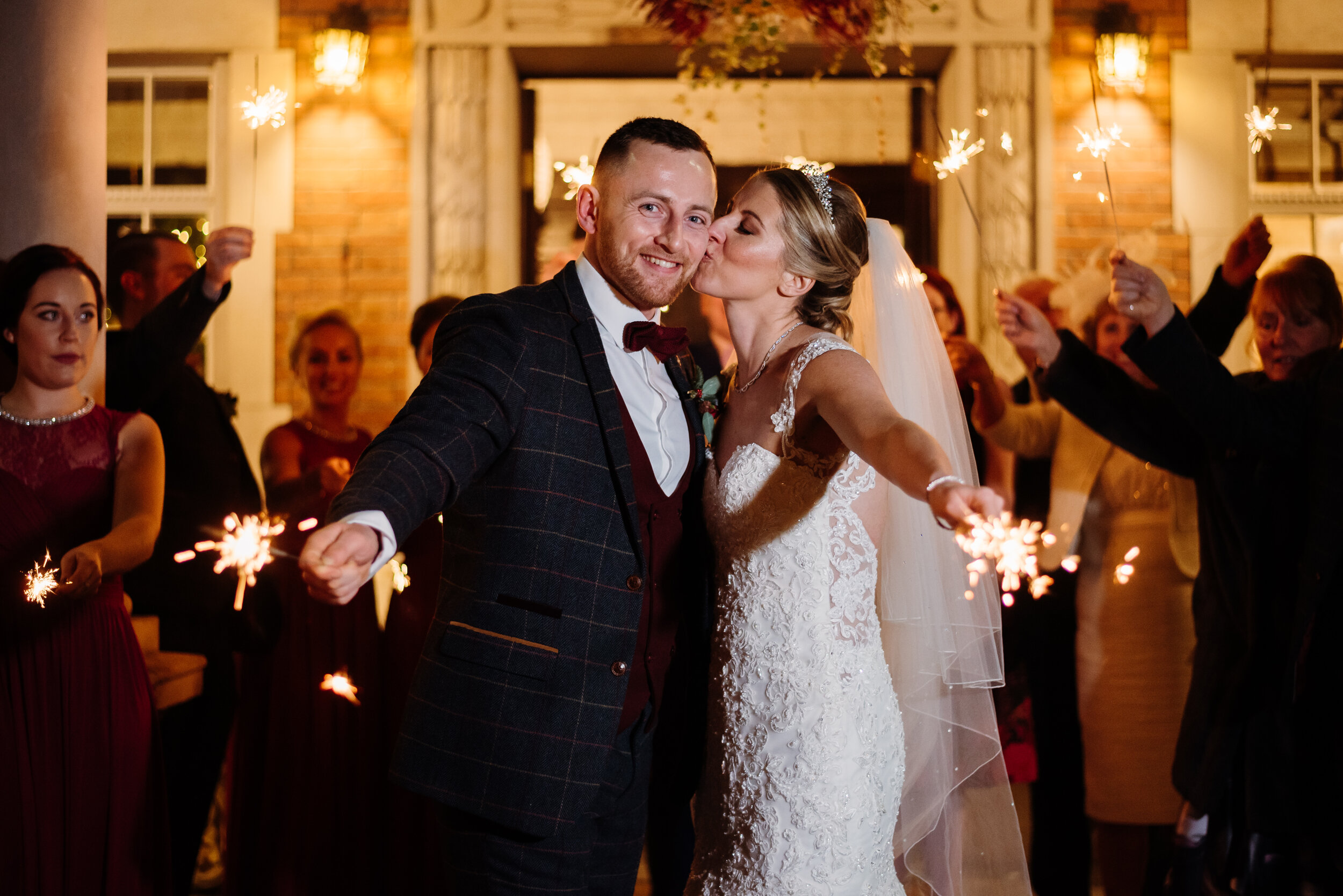 Bride and groom with sparklers at Eaves Hall