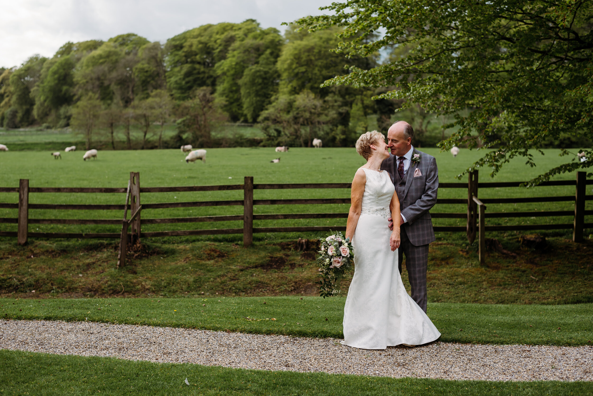 Gorgeous bride and groom in the garden at Mitton Hall