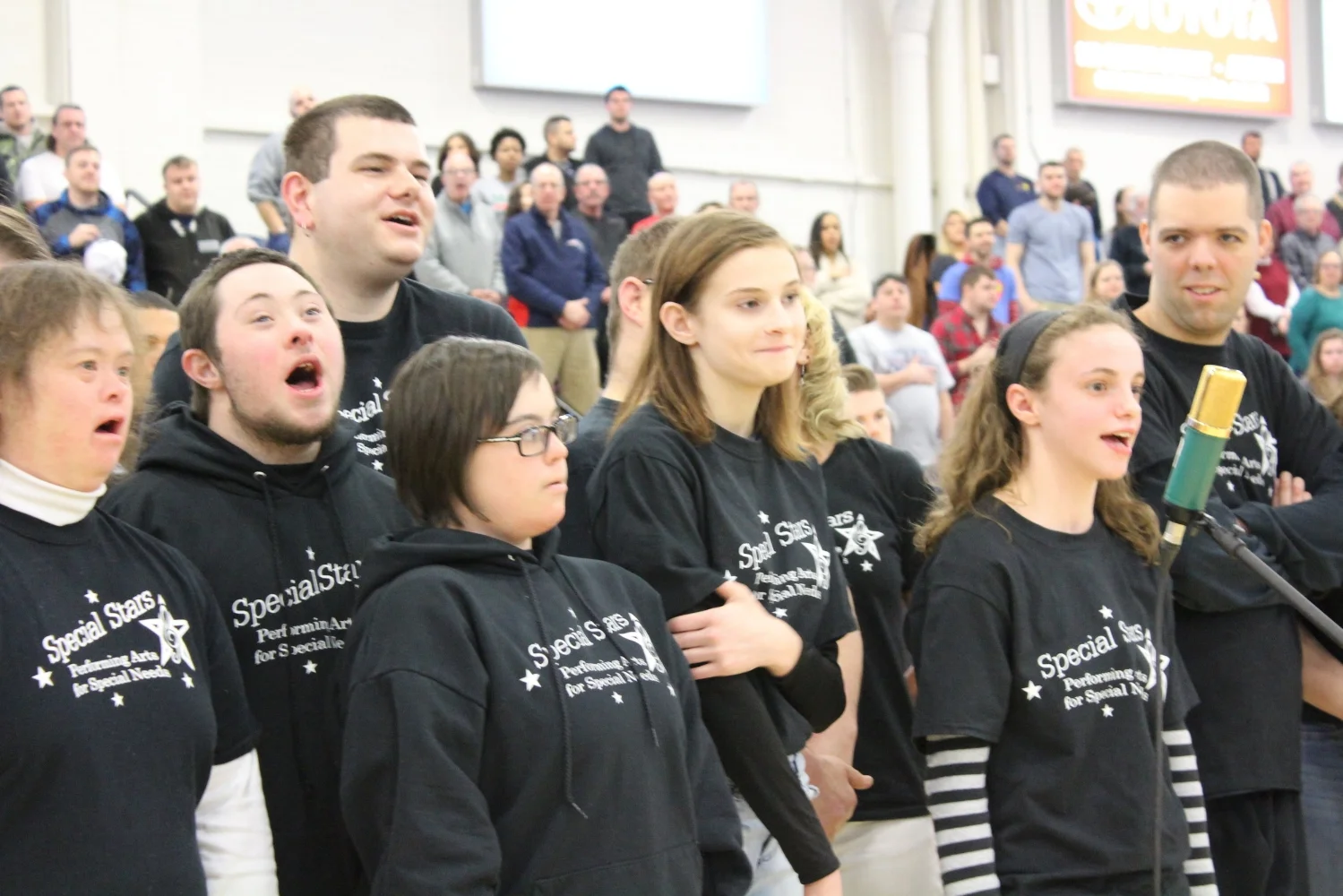 Special Stars students perform the National Anthem at the Maine Red Claws game
