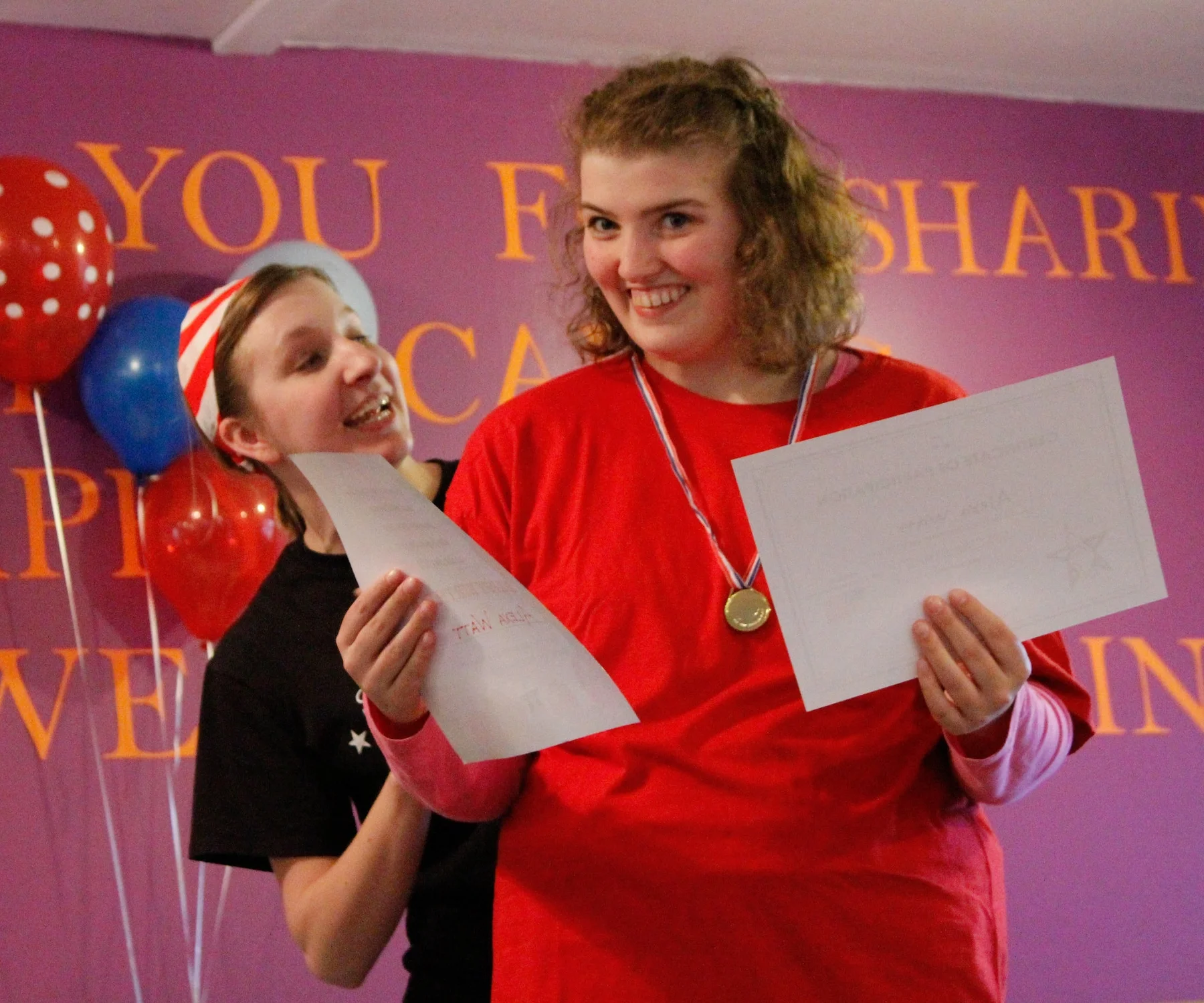 Alexa, a Special Stars Student, receiving her end of session certificate for her hard work! 