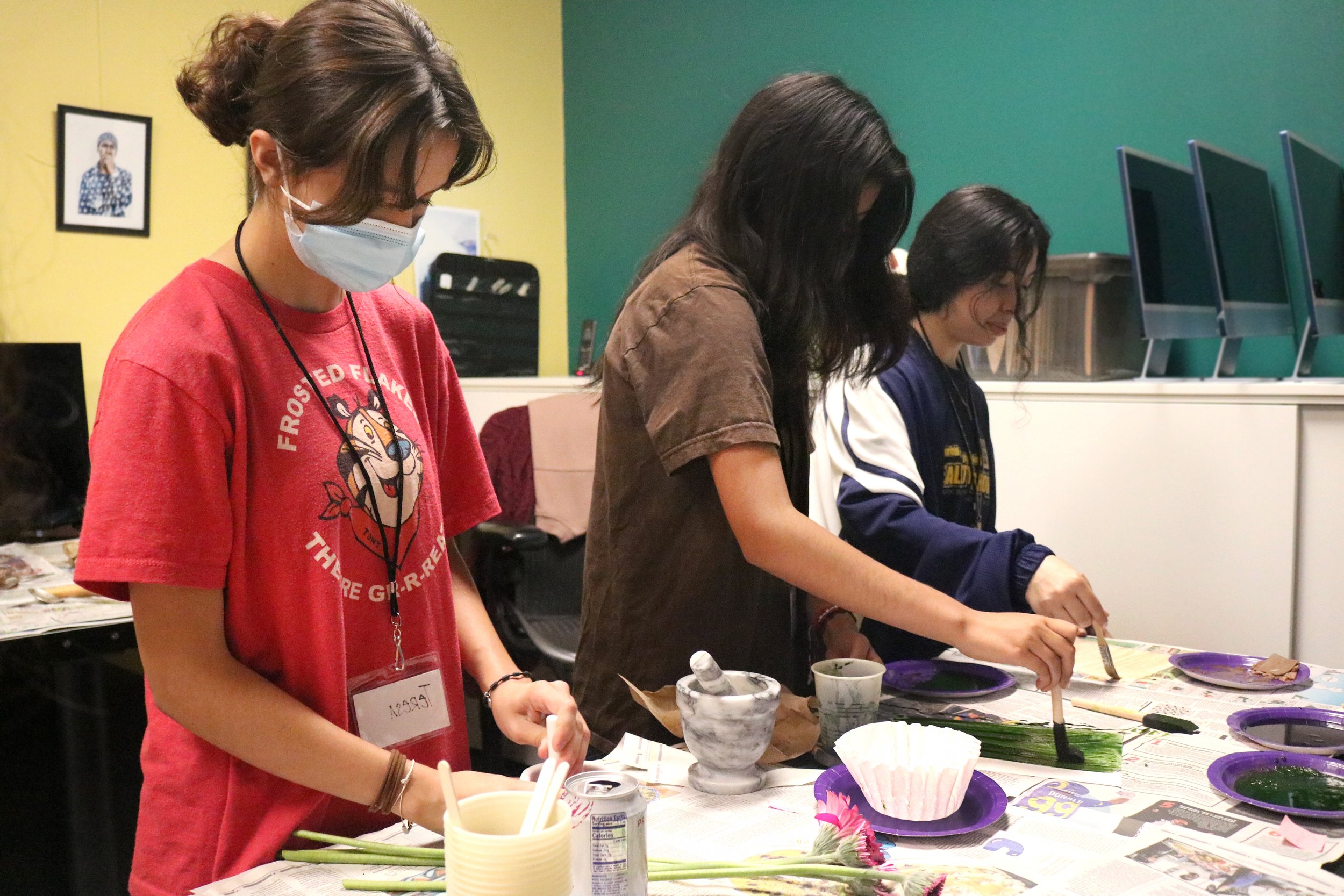  Students experimented with crushed-up flowers, berries, and leaves&nbsp;to create emulsions to then use in printing their photos on transparencies. 