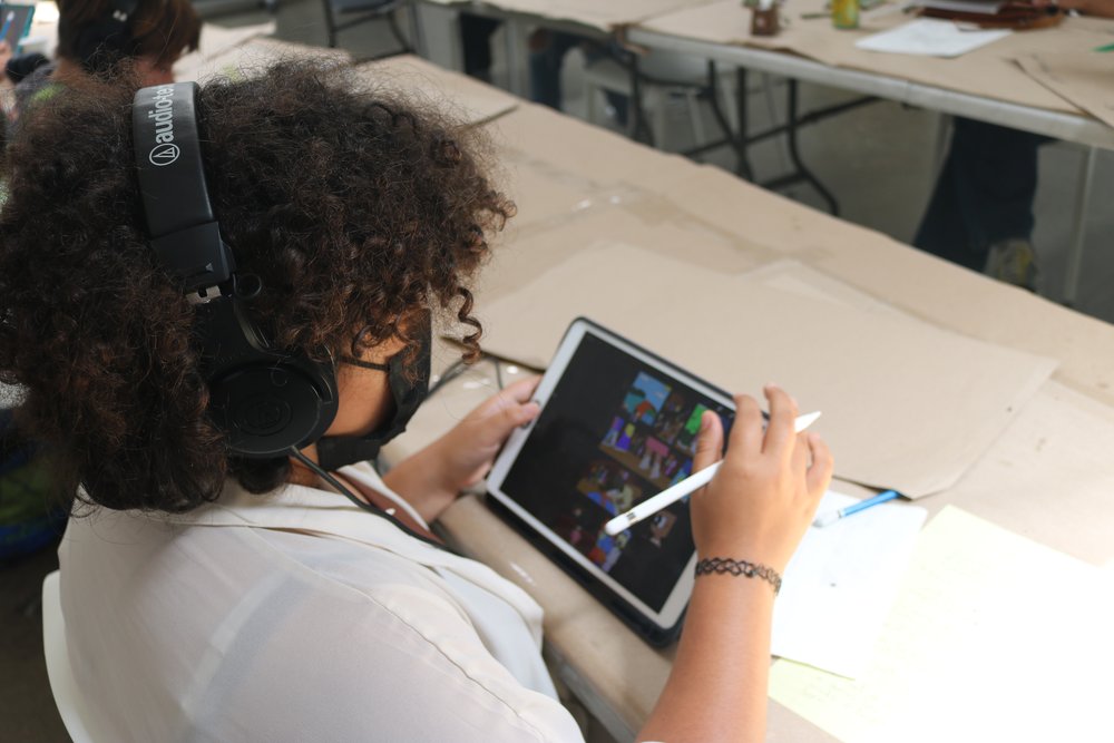  A comics student puts the finishing touches on a drawing using software on an iPad. 