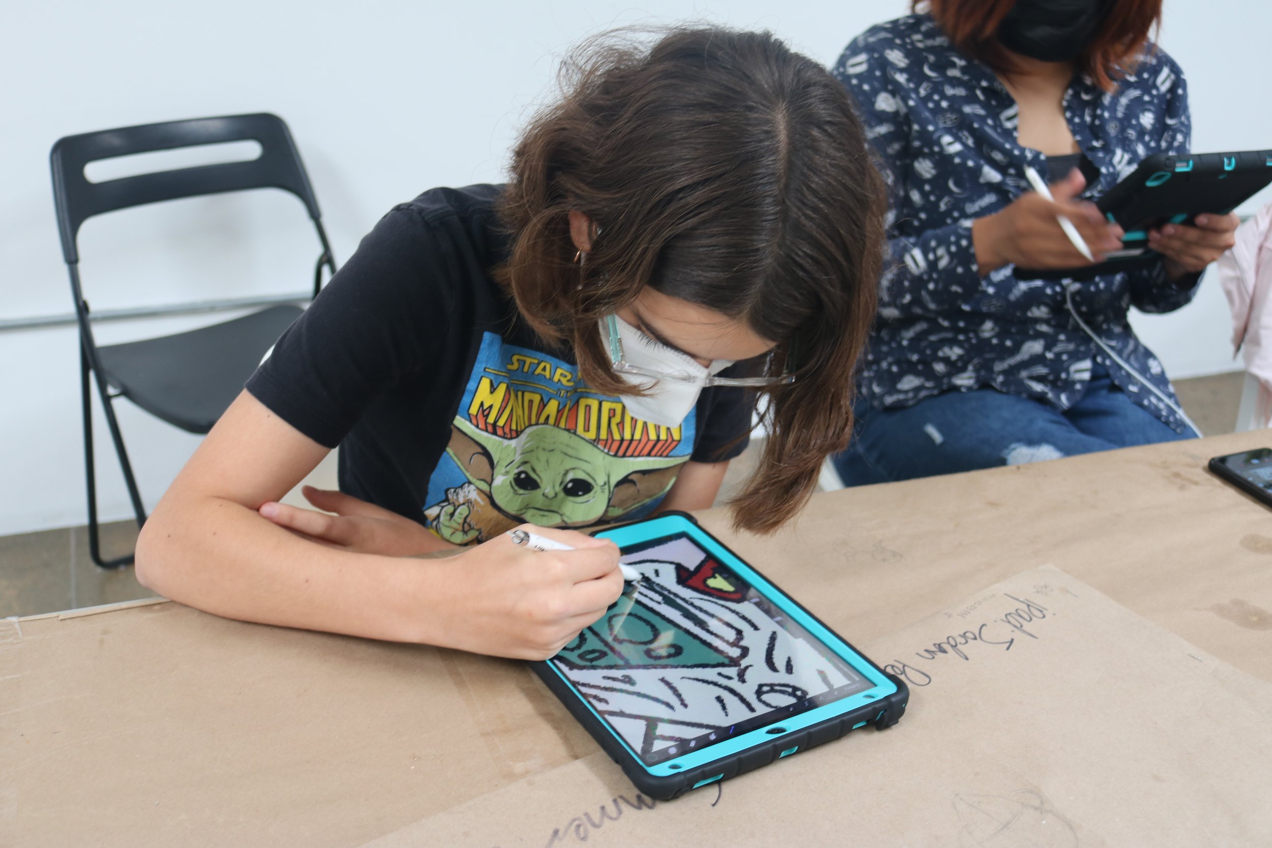  A comics students digitally colors their comic. 