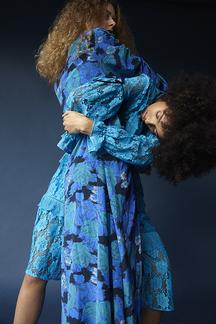 Erin wears blue floral dress Preen by Thornton Bregazzi. Nadia wears blue lace dress Preen Line