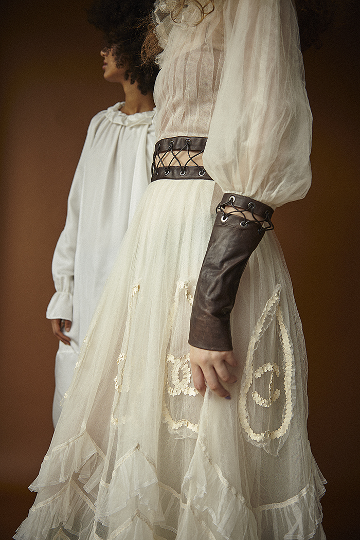 Erin (right) wears chiffon dress by Chanel and Nadia (left) wears silk dress by Steven Tai