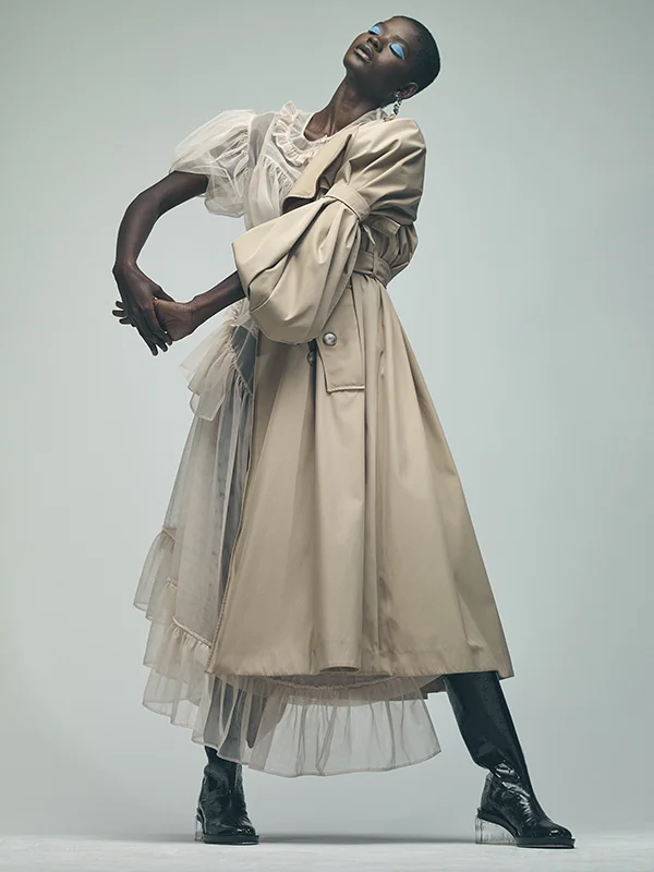Toulle top, skirt and leather boots all Simone Rocha , silver earrings and rings Zohra Rahman