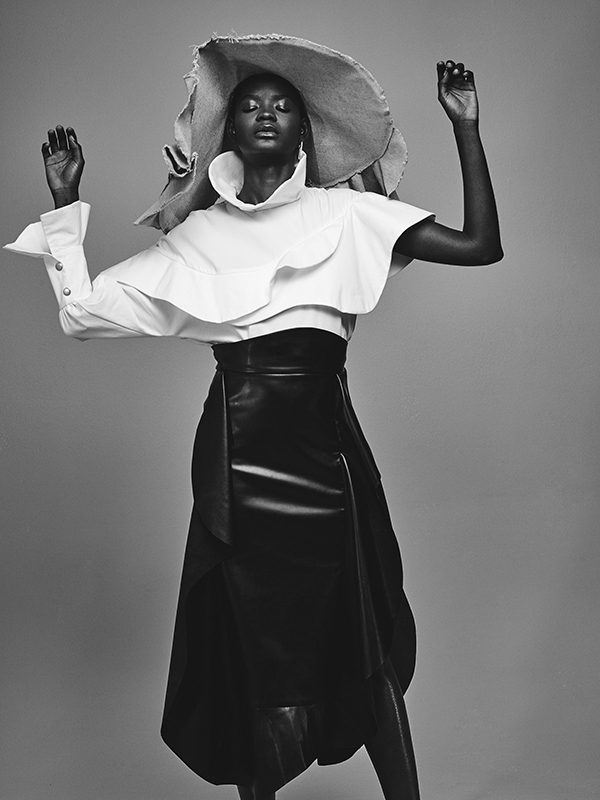 Leather skirt, top and hat all AWAKE, and Silver earring Zohra Rahman