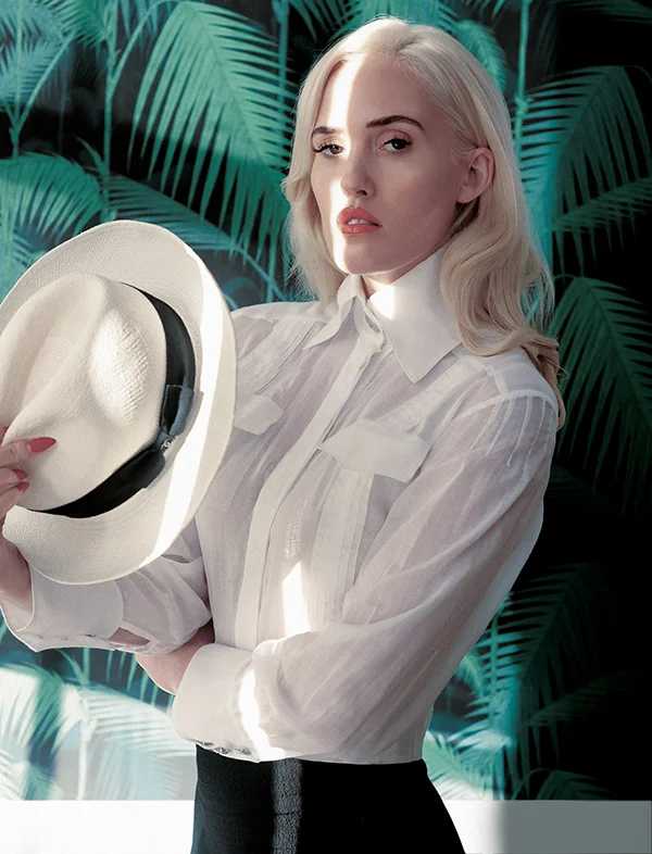 Gauze shirt and Panama hat: Chanel / Black trousers: Rejina Pyo