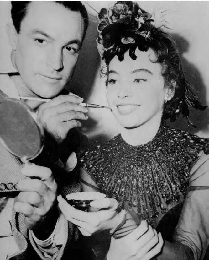 Behind-the-scenes shot of Caron and Kelly on the set of An American in Paris