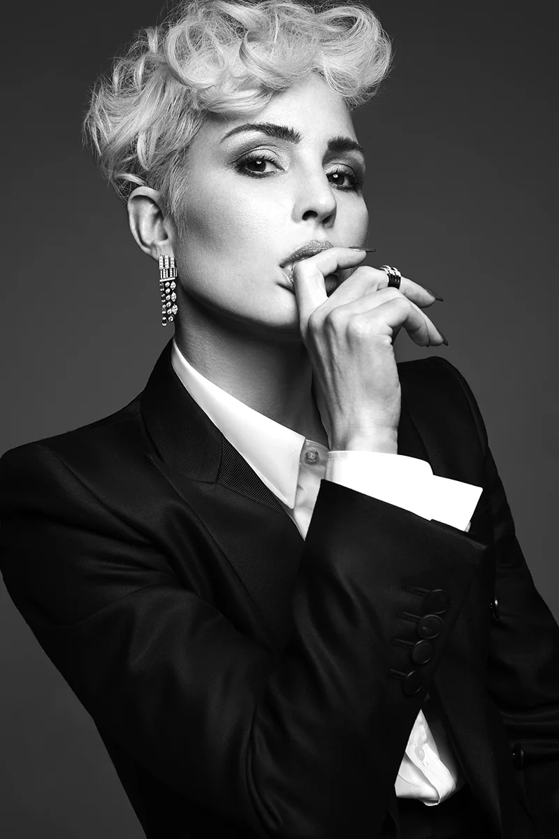 Suit: Bottega Veneta / White shirt: Gucci @ mrporter.com / Earrings: Chanel / Rings: De Beers