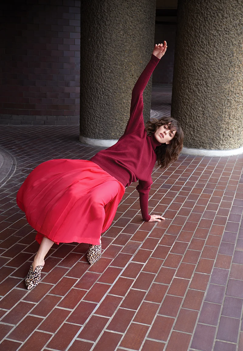 Roll neck and pleated skirt: Victoria Beckham / Leopard shoes: Tibi