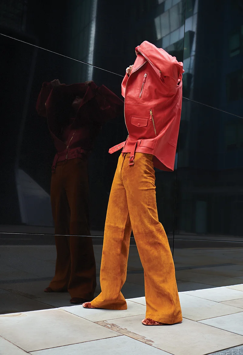 Long leather jacket: Tod’s / Brown suede trousers: Theory / Crushed velvet shoes: Yuul Yie