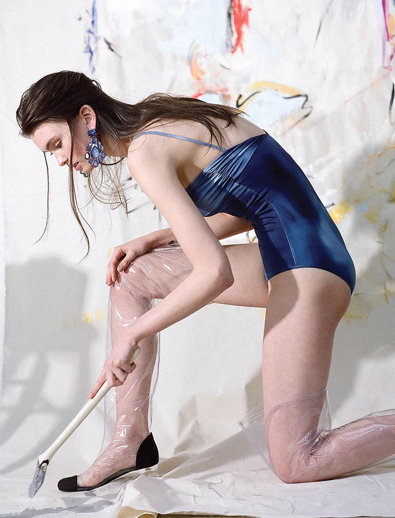Swimsuit, boots and earrings: Chanel