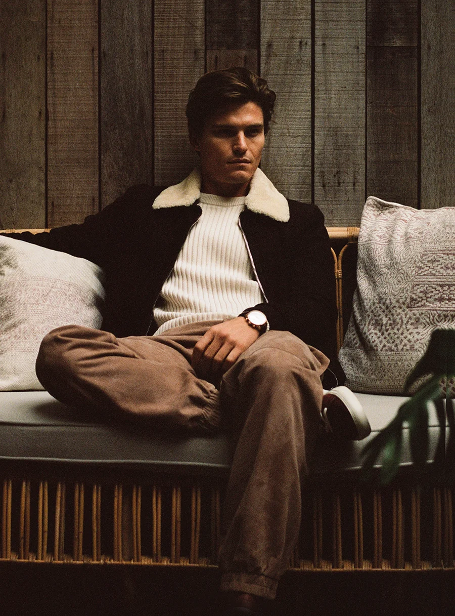 Jumper and jacket: Mr P / Trousers: Cerruti / Trainers: Harrys of London / Watch: IWC