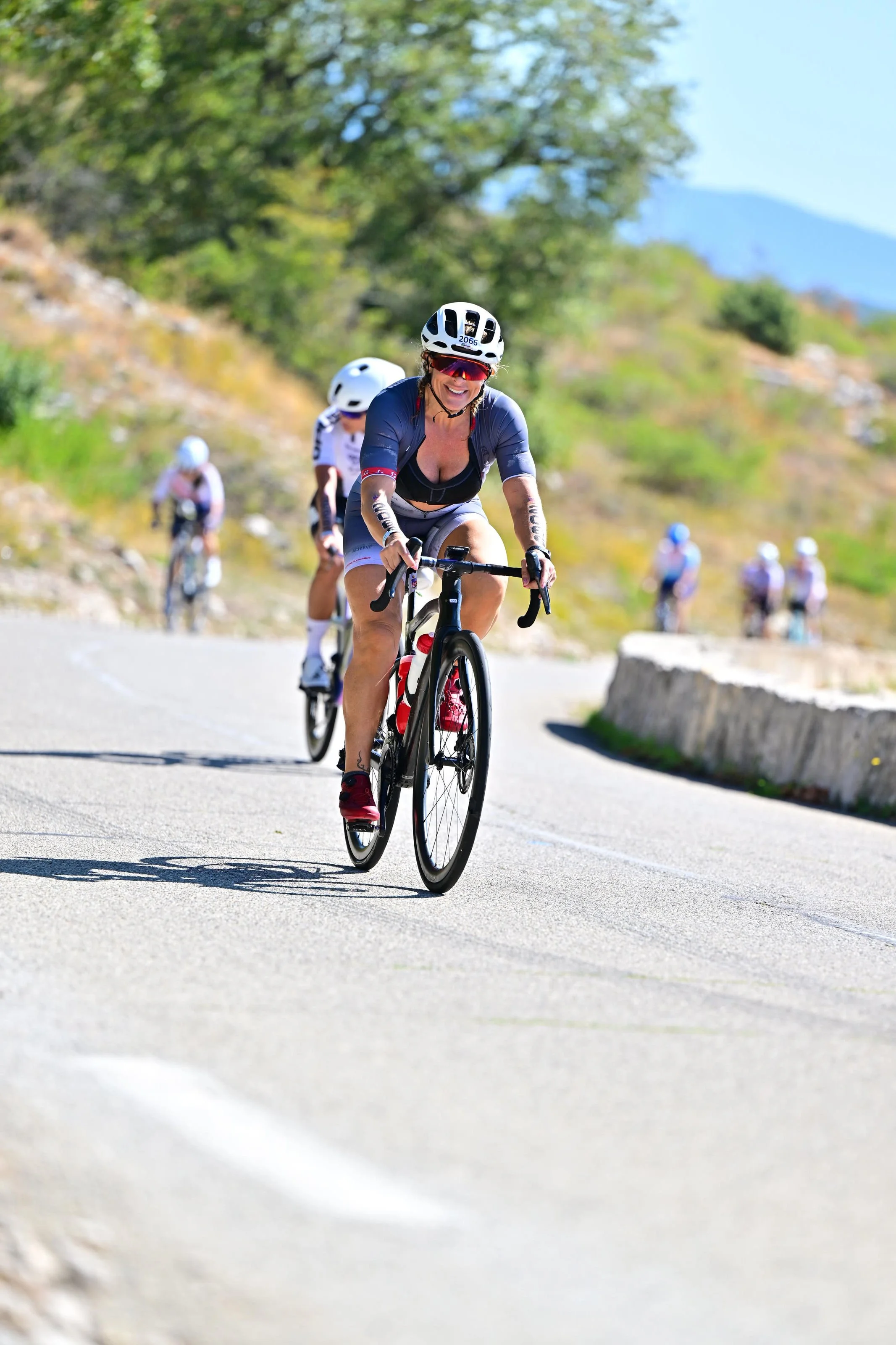Rosa Laura Saggese Elbooz climbing on the bike course at the 2026 IRONMAN 70.3 World Championship in Nice, France.
