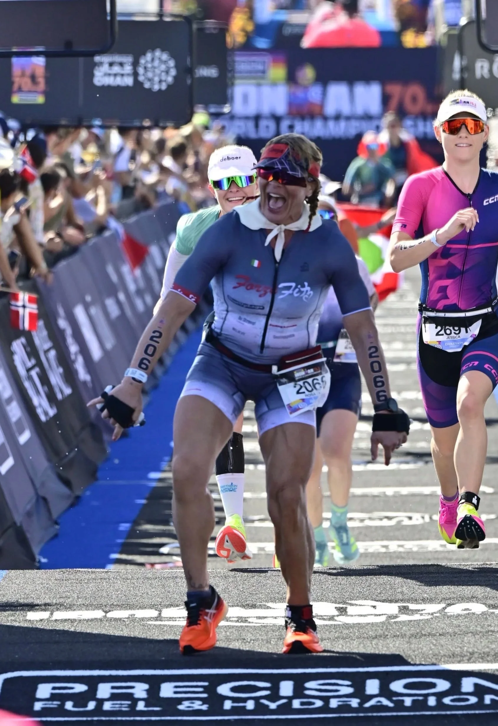 Rosa Laura smiling and celebrating after her finish-line jump at the 2026 IRONMAN 70.3 World Championship in Nice, France.
