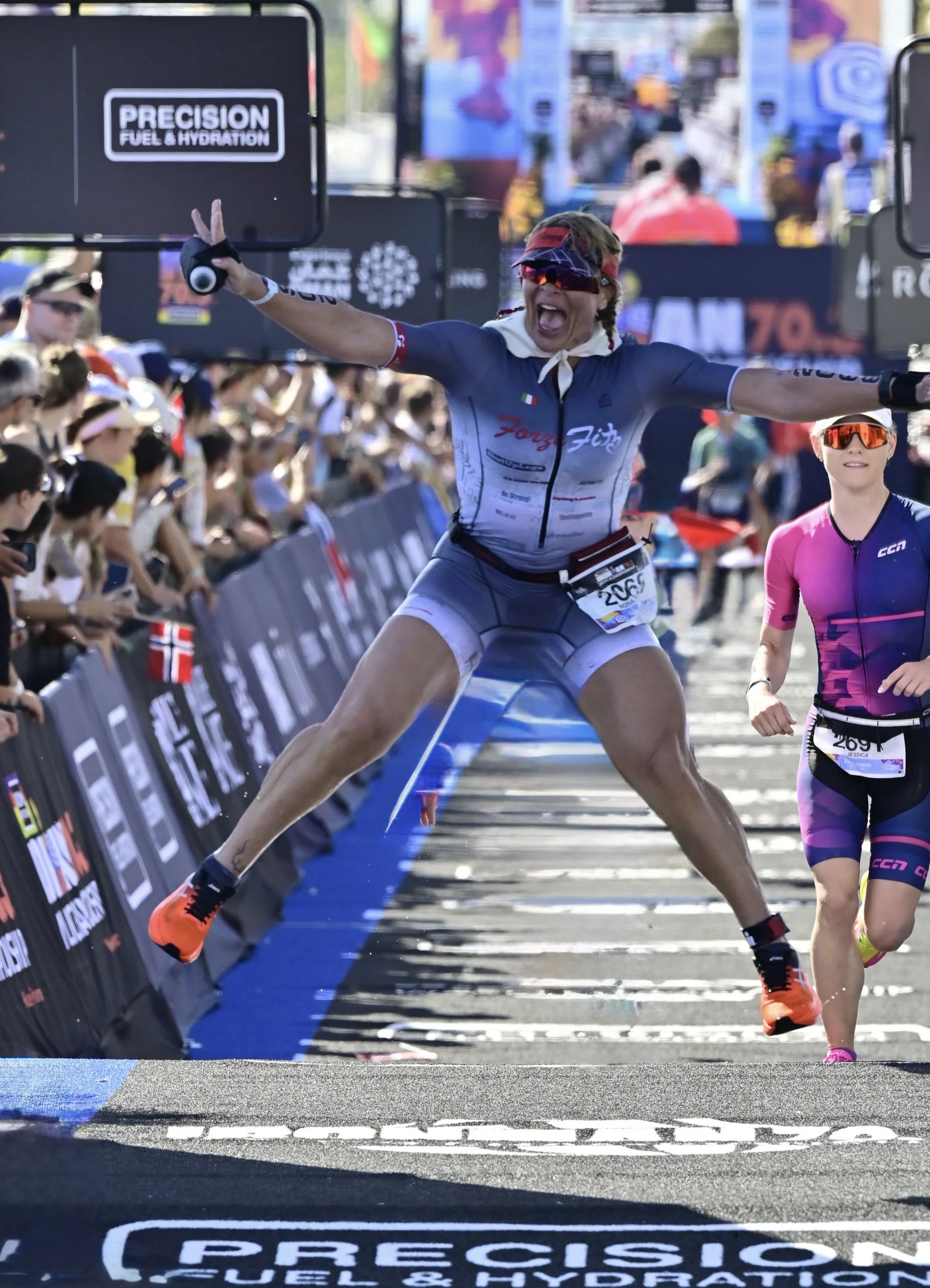 Rosa Laura jumping in celebration at the finish line of the 2026 IRONMAN 70.3 World Championship in Nice, France.