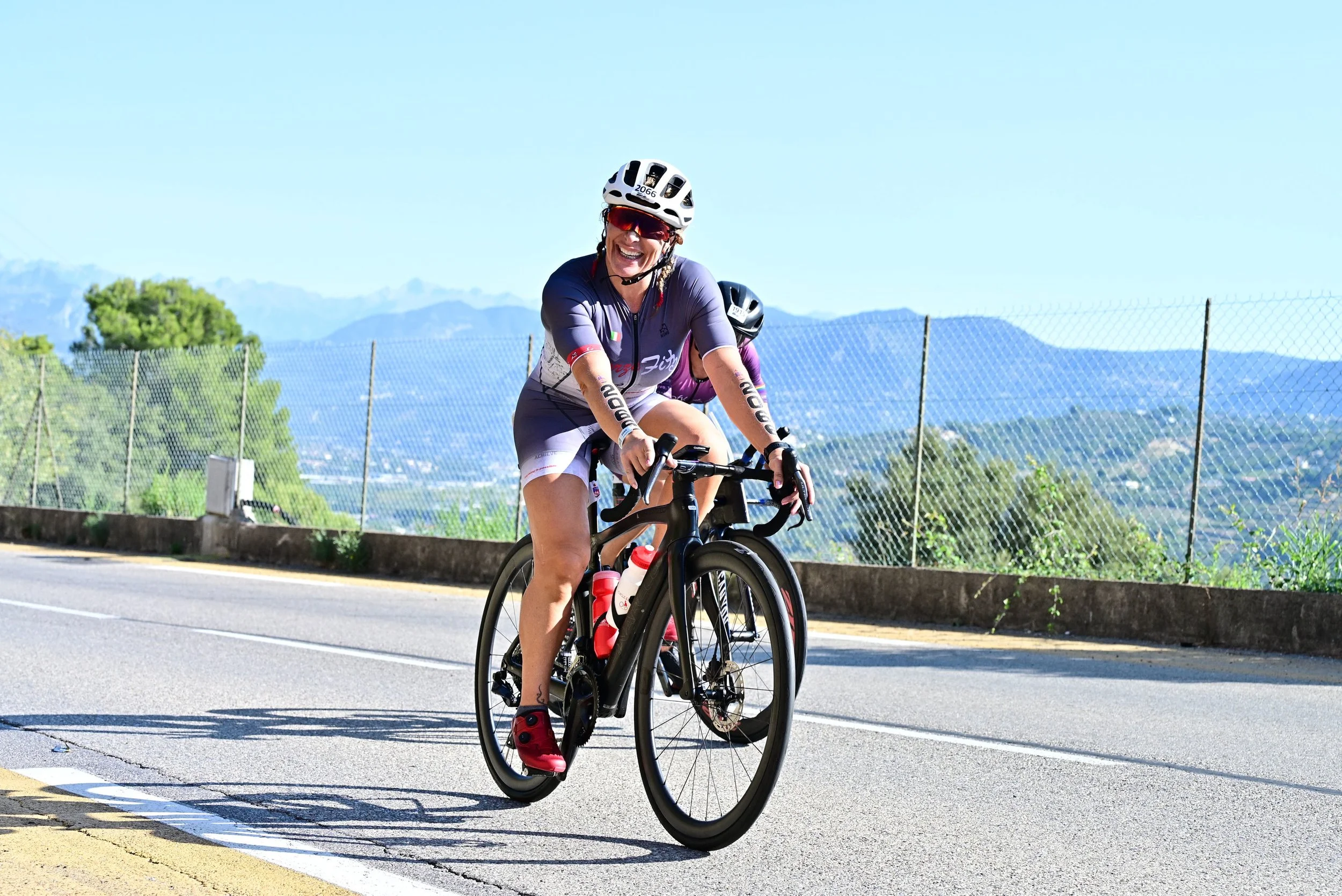 Rosa Laura Saggese Elbooz smiling on the bike course at the 2026 IRONMAN 70.3 World Championship in Nice, France.