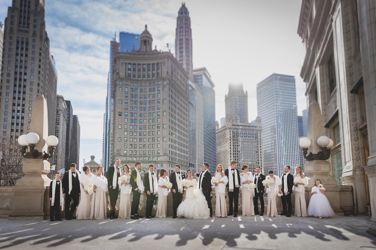 Katlyn + Bo. Some winter days can give us spectacular light. Photo by @bc__photo @code_man31 @figweddings @chibuildings #figweddings #wrigleybuilding #weddingphotography #weddingphotoinspiration #chicagobrides #canonusa #chicagoweddingphotographer #l