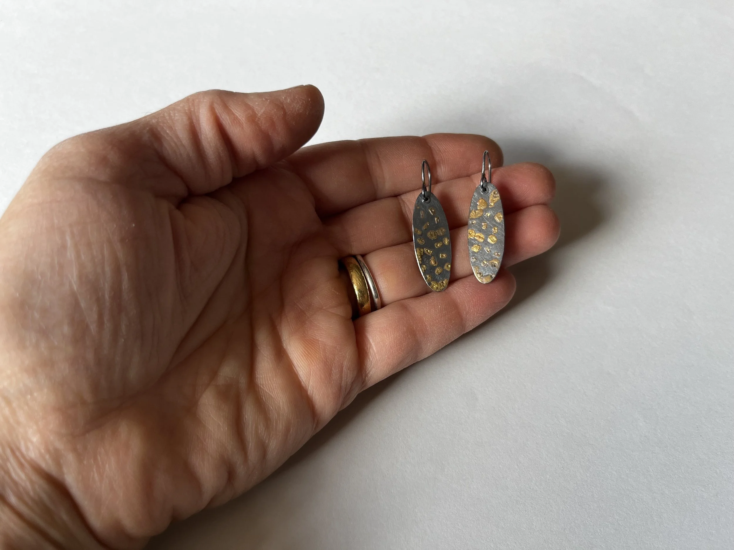 sidewalk earrings in hand.jpg