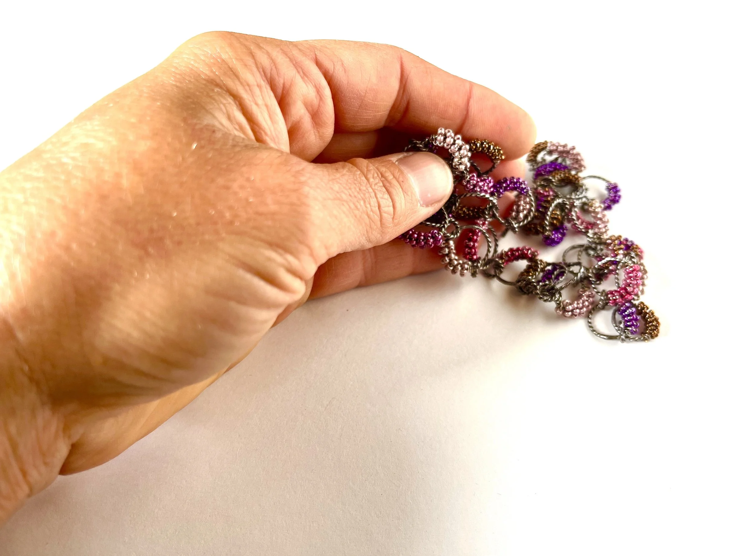 mini circle necklace in hand.jpg
