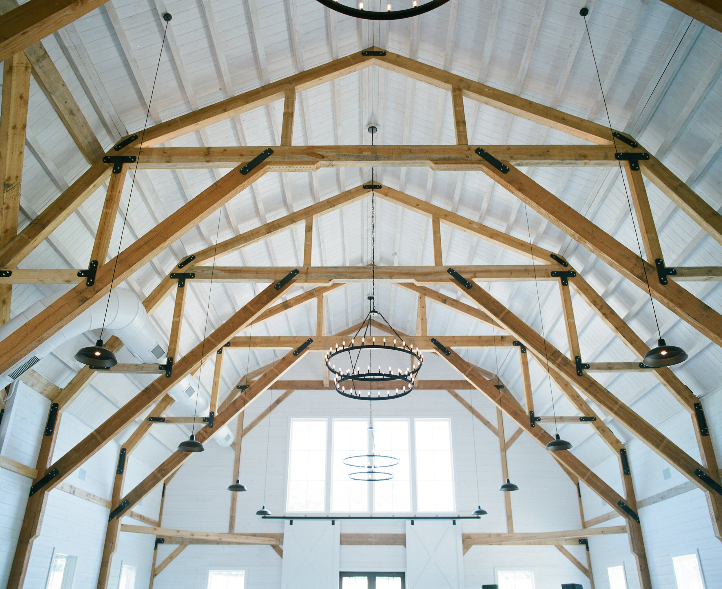  [PHOTO] Sunlight streams through the windows in a view looking up up in the Gambrel Room 
