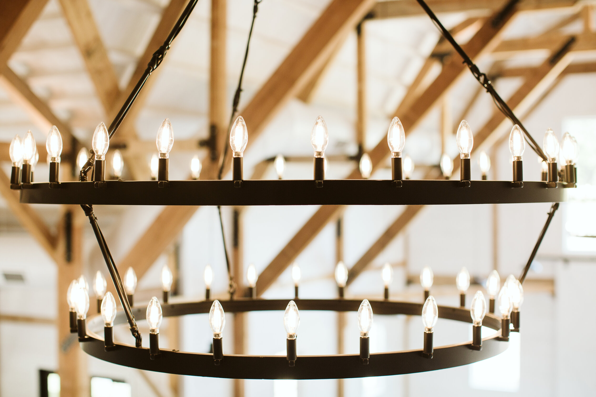  [PHOTO] Close-up of Gambrel Room chandeliers with candle lights 