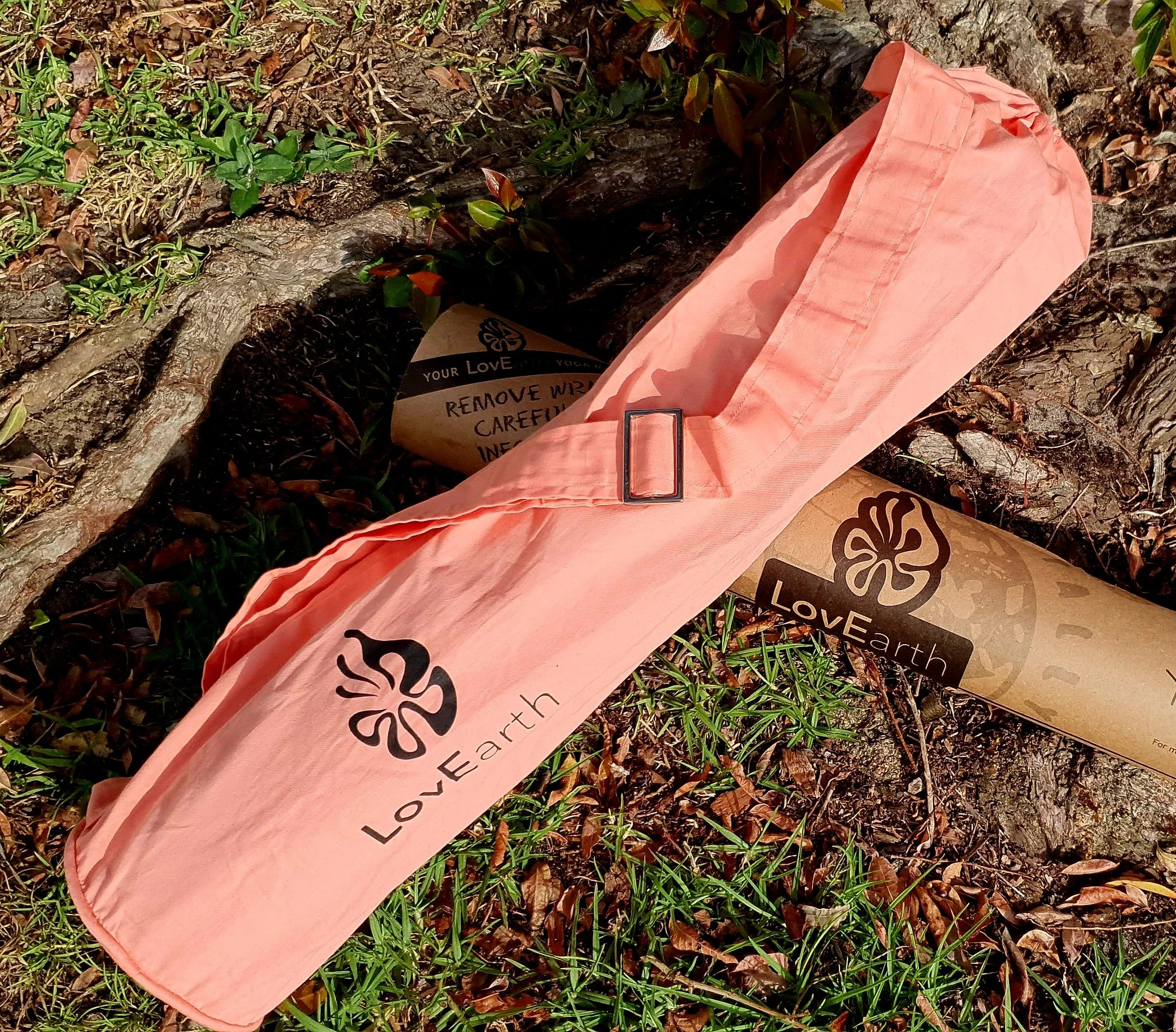 LovEarth 4mm luxury studio yoga mat dyed with WEstern Australian red Ochre designed for pure practice with natural grip, comfort and grounded support. Shown here with is mat bag.