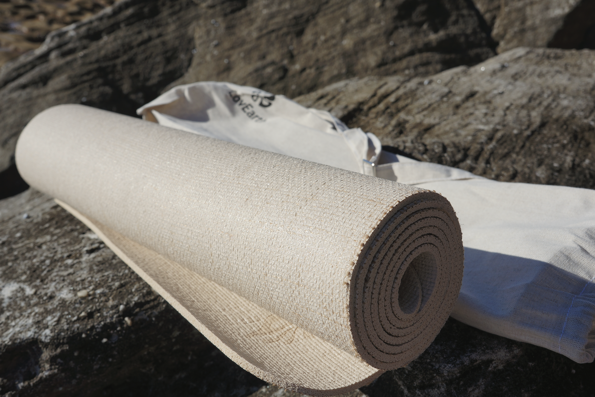 4mm natural jute yoga mat by LovEarth showing the textured plant-fibre surface designed for grip during practice.