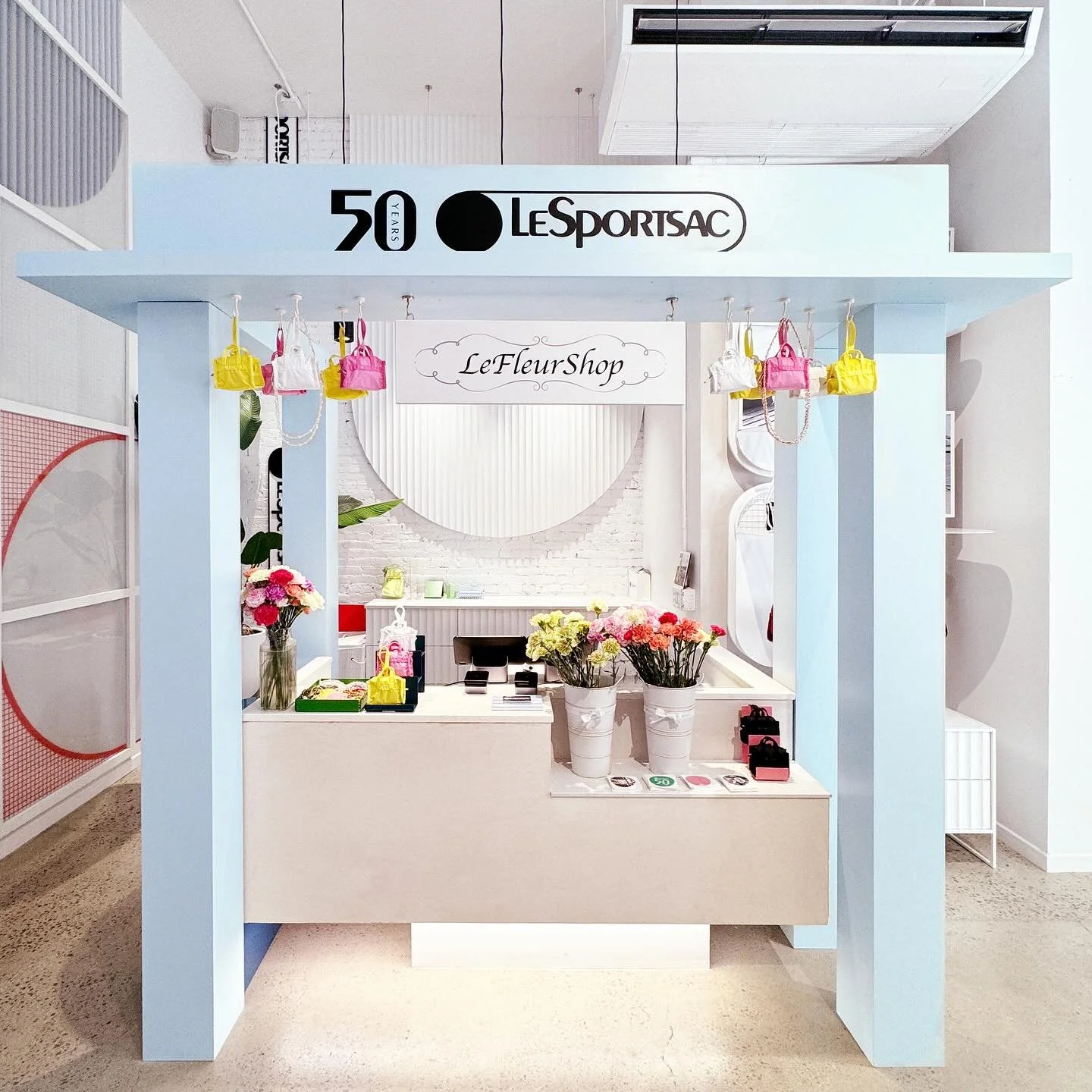 Welcome to the LeFleurShop flower stand designed as an in store experience as part of the @lesportsac 50th Anniversary celebration! 👜 So fun!