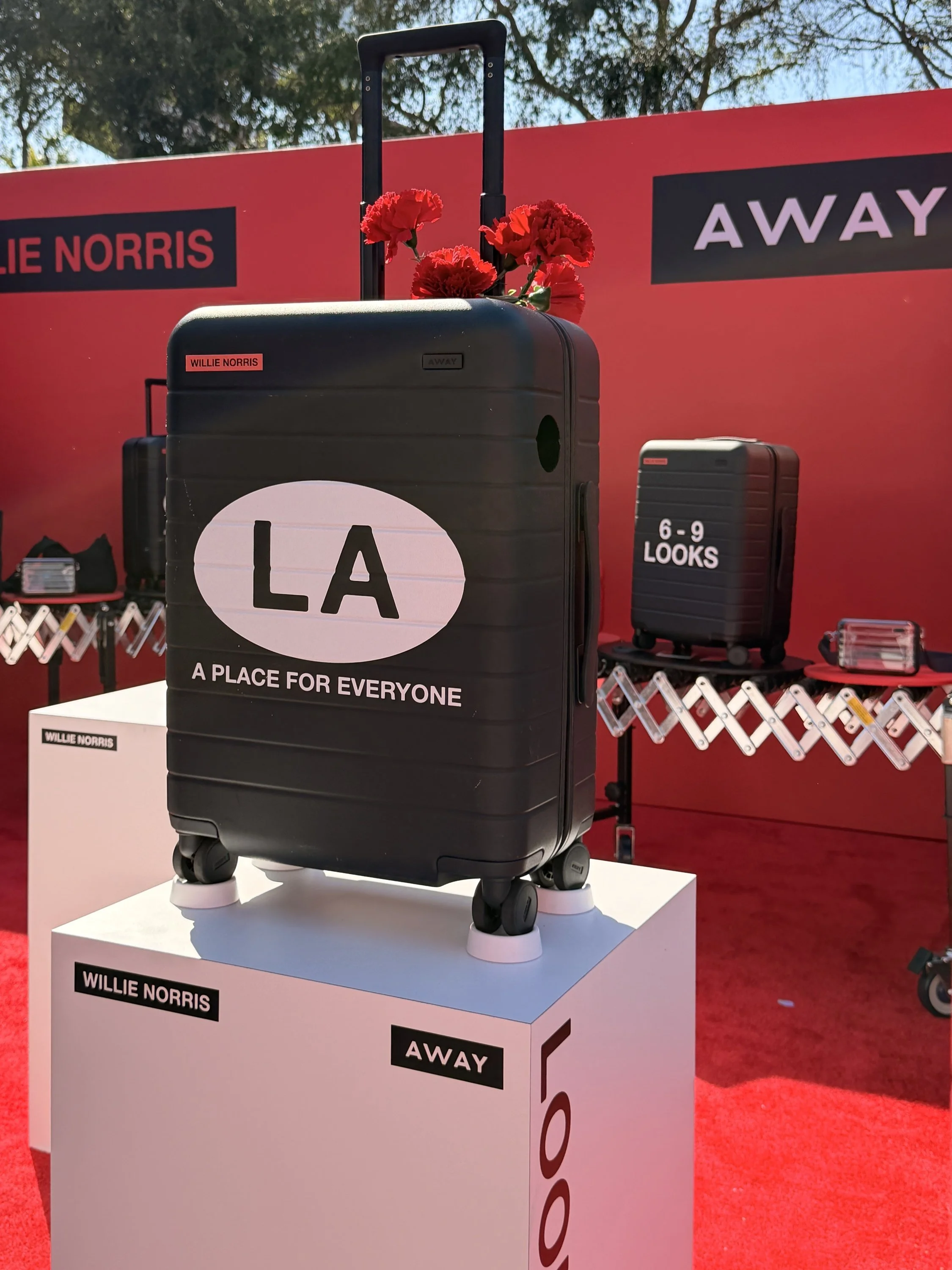 Away x Willie Norris Pride 2026 LA suitcase in West Hollywood
