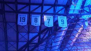 Banners of the Dallas Stars retired numbers up in the rafters