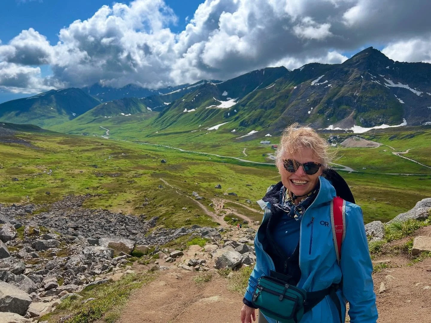 Someone coming down the trail as I was going up said I needed a photo of myself with that view in the background and that the light was perfect. How could i resist?
Alaskan sun made me a blond for a second!