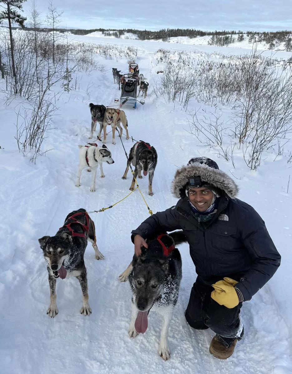Happy Tails Manager Vee with his dogsled team