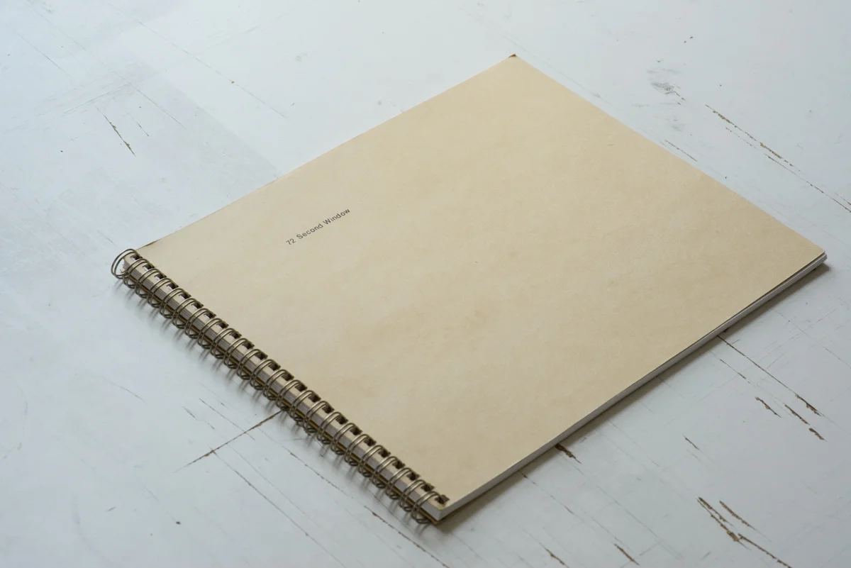 72 Second Window Houseboat 2013 8"x10" Spiral Bound 80 pages Edition of 25 Out of Print A book for short interactions and communications with strangers and foreign situations. The book's title comes from an anomaly recorded at the Very Large Array and is thought to be a possible communication with extra terrestrials. This book is part of a three book set that includes works by Eric Ruby and Dylan Nelson.