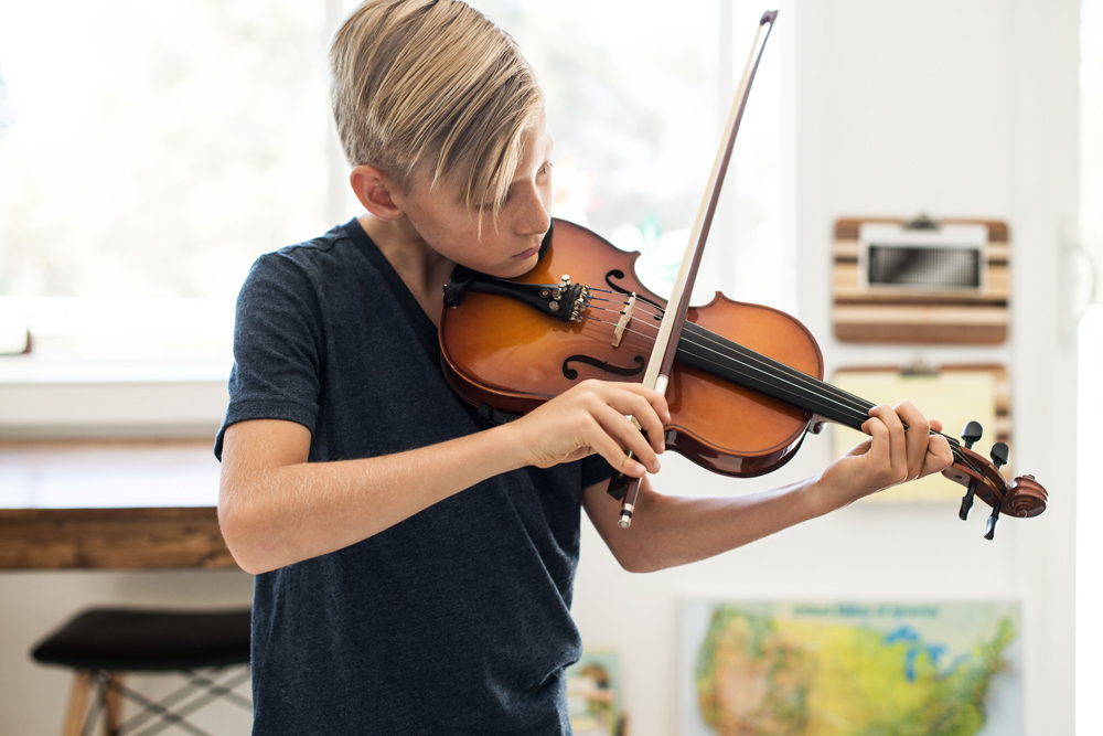 When Carter had discovered the news of his very own violin coming in the mail, he requested that we head to the library so he could check out books pertaining to music. The morning after our library trip, I had found a sheet of paper with diagramed bass clef and the treble clef bar lines, all of the appropriate notes, and several music theory terms and definitions written down. It blew me away, but it was confirmation that he was ready and his heart was excited. As soon as the violin arrived he started playing and he hasn't stopped. He's amazing. He will walk into the room and play a song he had just read the music to, already memorized and ready to perform! Jason and I, in multiple situations, have just looked at each other in awe of this child. God is so good. He knew what he was doing when nudging us to introduce music.