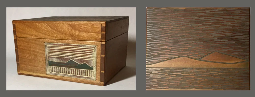 Cherry sawn-lid box with landscape carvings on front and top