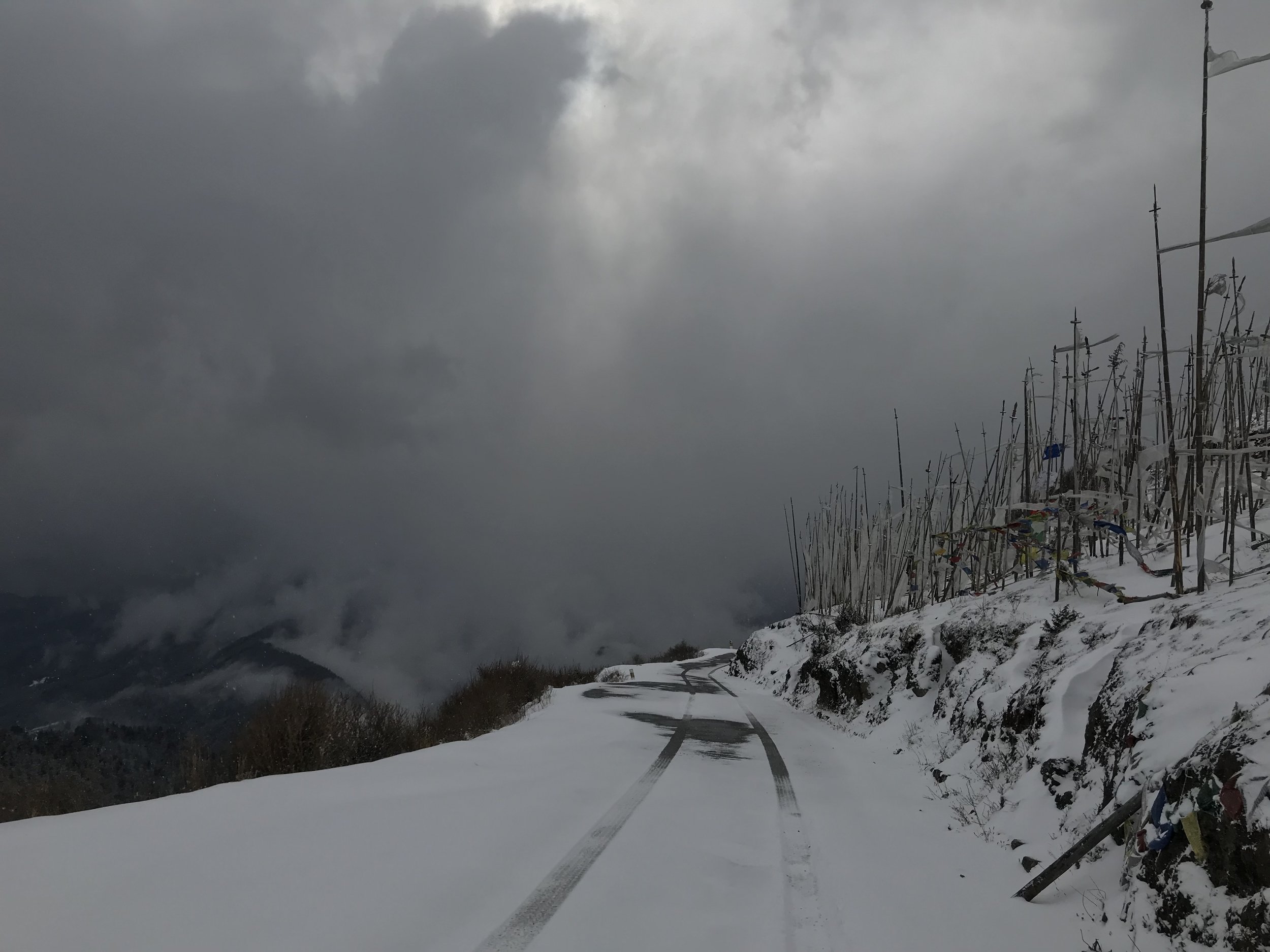Once we reach the top of Chele La, however, the road is mostly snowed over. Don’t look down!