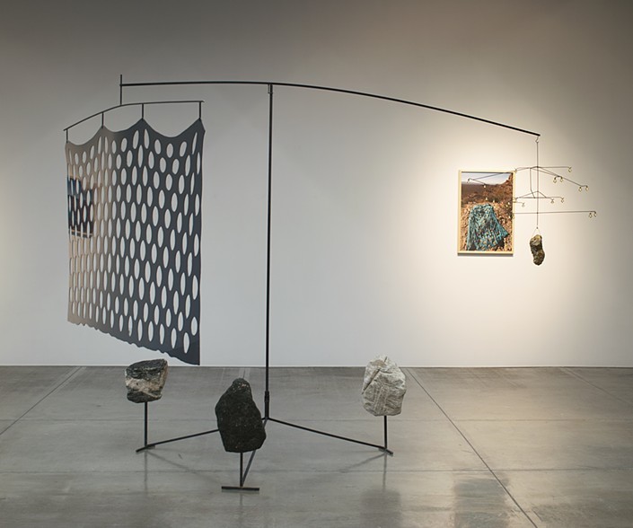 Prussian blue and the soft satellite , 2018, rocks, steel, plastic, brass bells