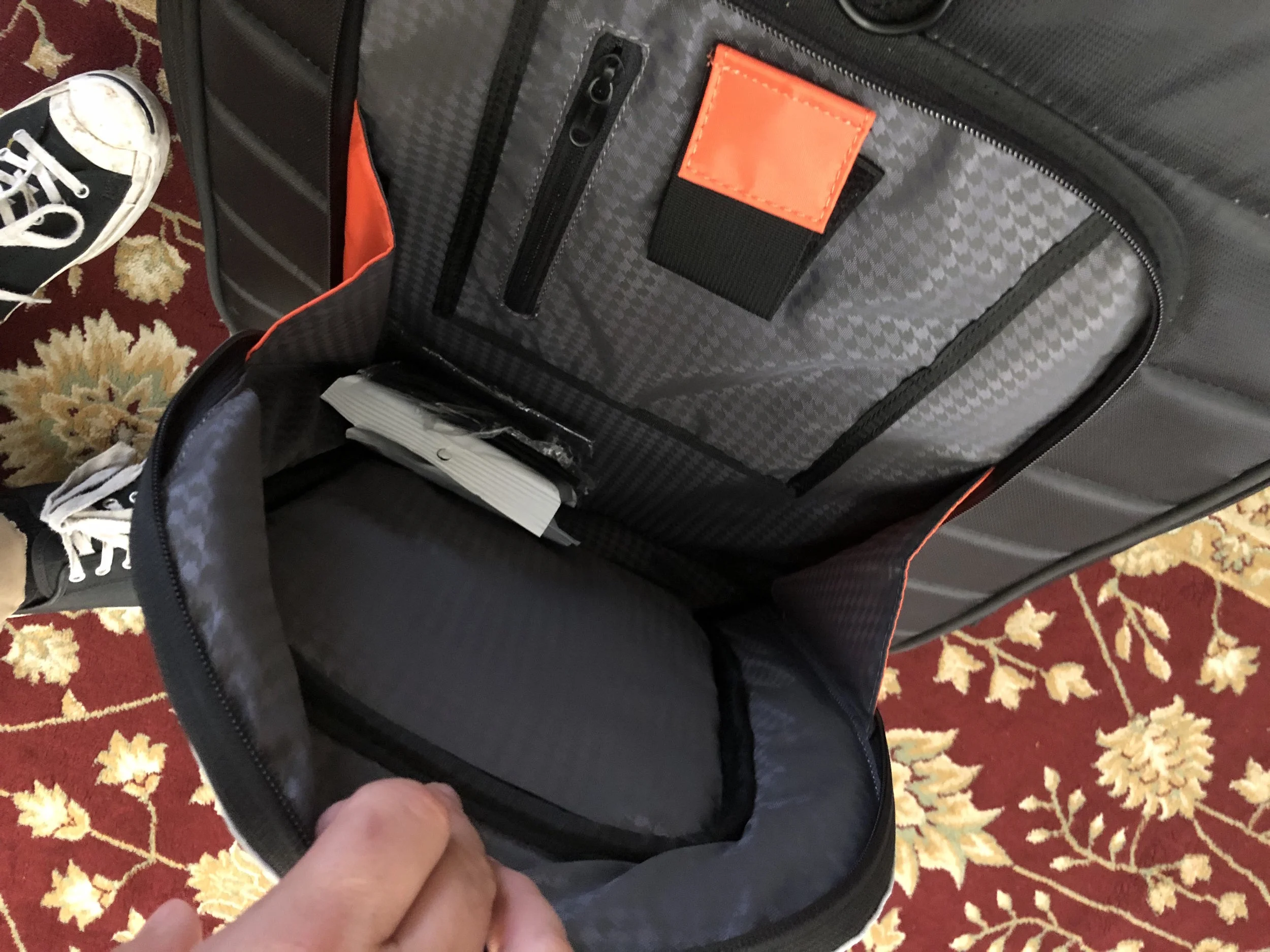 Tons of room in the lower pocket, including a cable strap.
