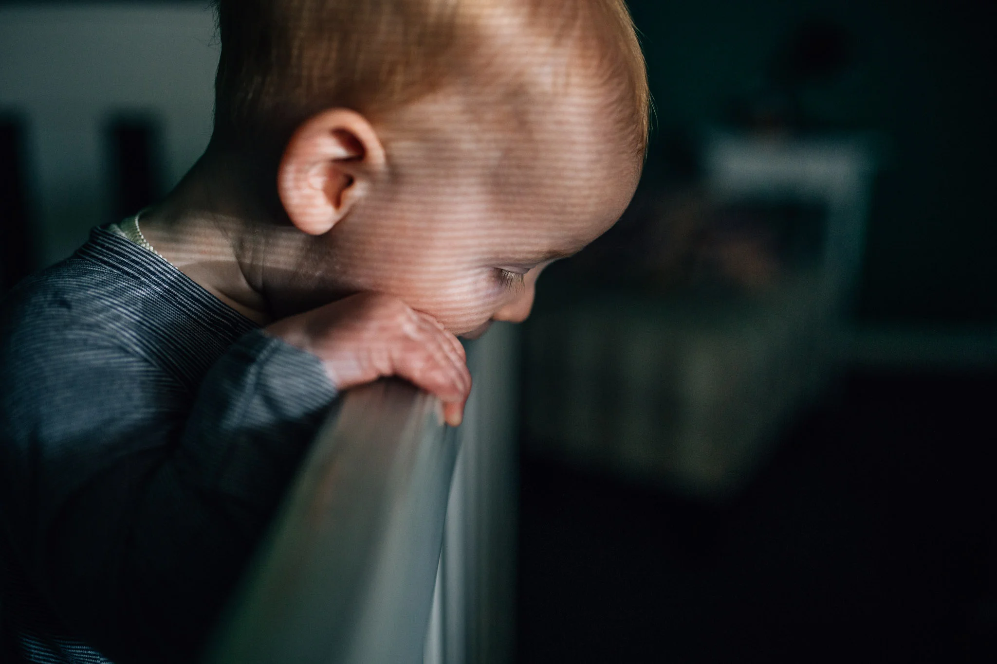 There is nothing 'bright and airy' about this baby's room. But none of that matters when you're documenting life.