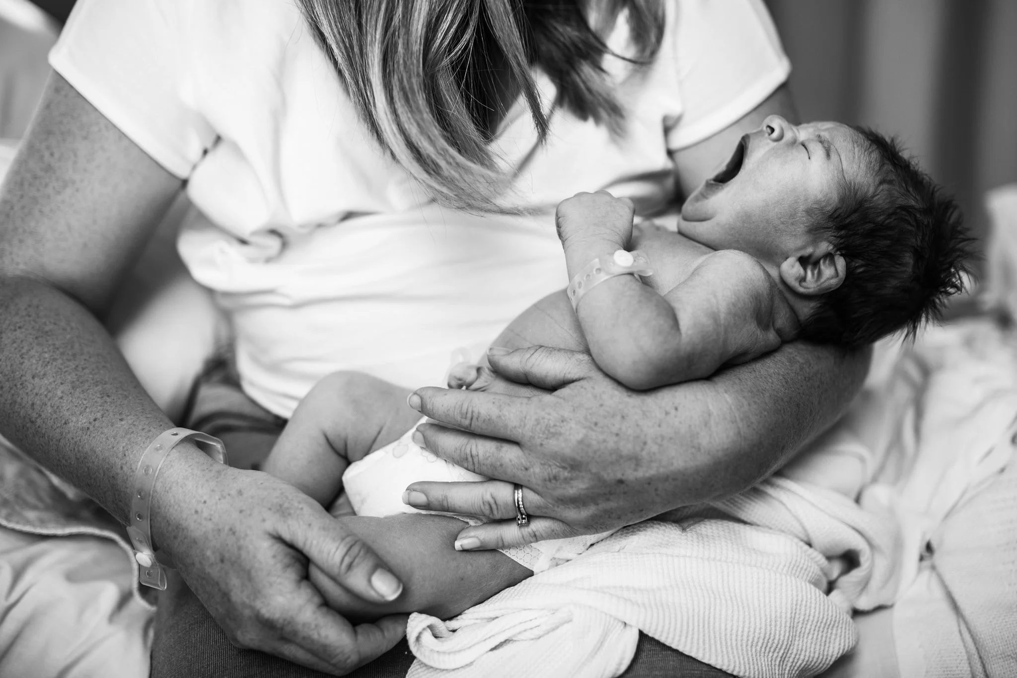 mother holding yawning newborn (1 of 1).jpg