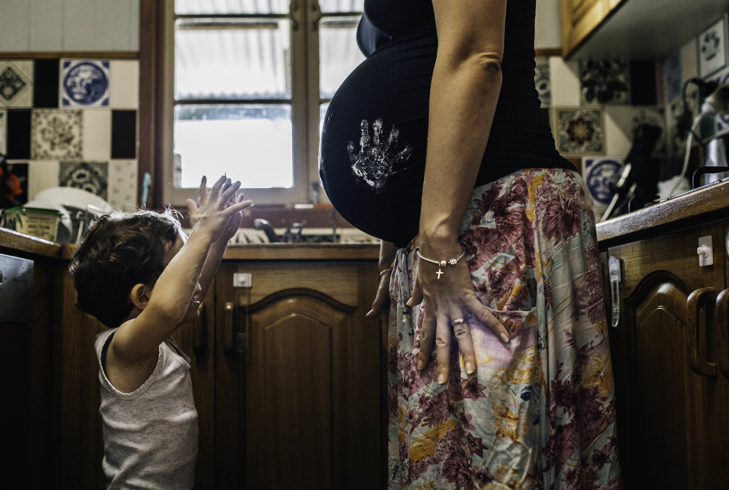 pregnant mother and son in kitchen.jpg