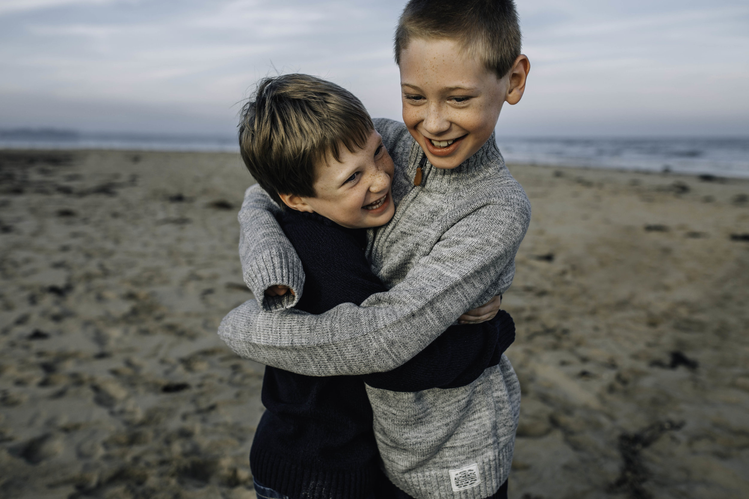 brothers-hugging-on-beach.jpg